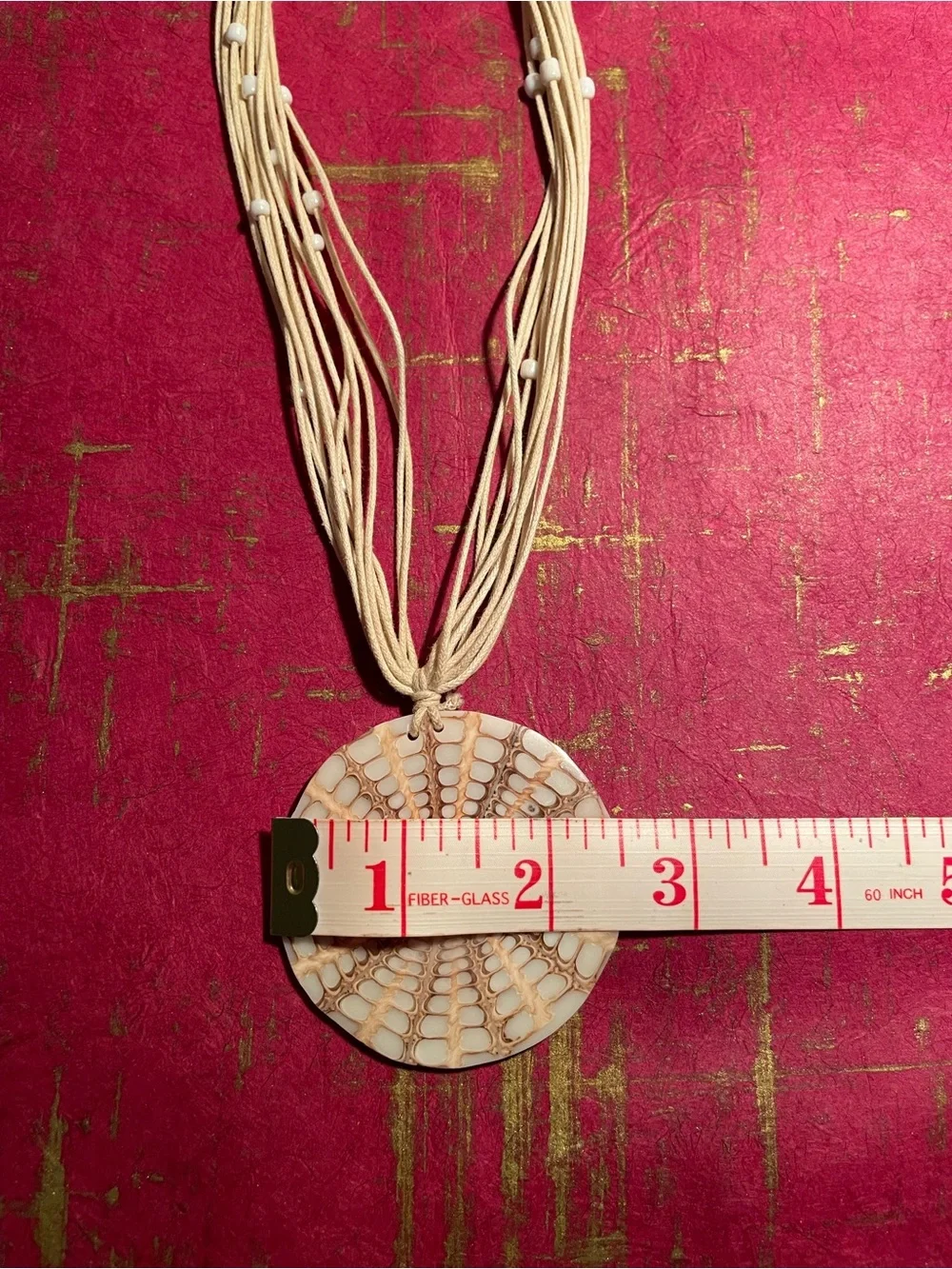 Handcrafted Cream Multi-Strand Necklace with Round Pendant